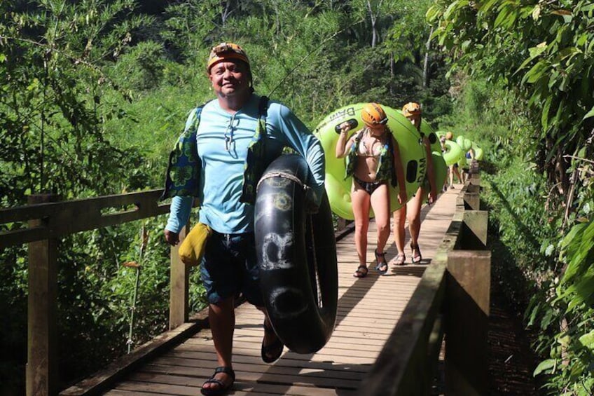 The lush jungle walk with tubes to the cave entrance