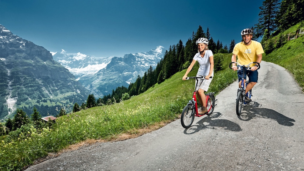Couple on a scenic bike tour in Zurich, Switzerland