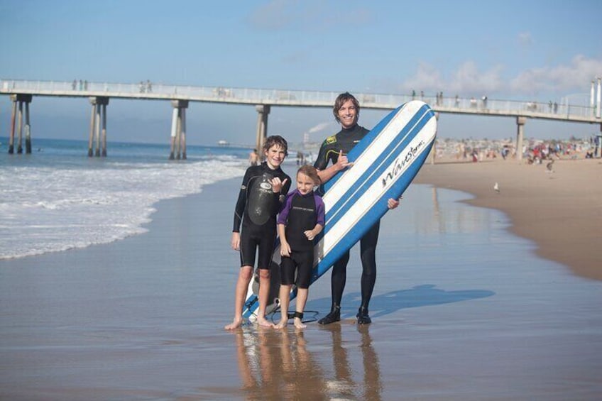 Happy kids and a stoked instructor snap a picture after a fun lesson.