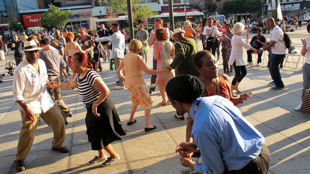 Swing dancers on the sidewalk