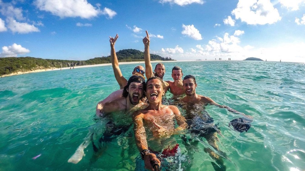 Show item 5 of 5. Group of people swimming in Queensland