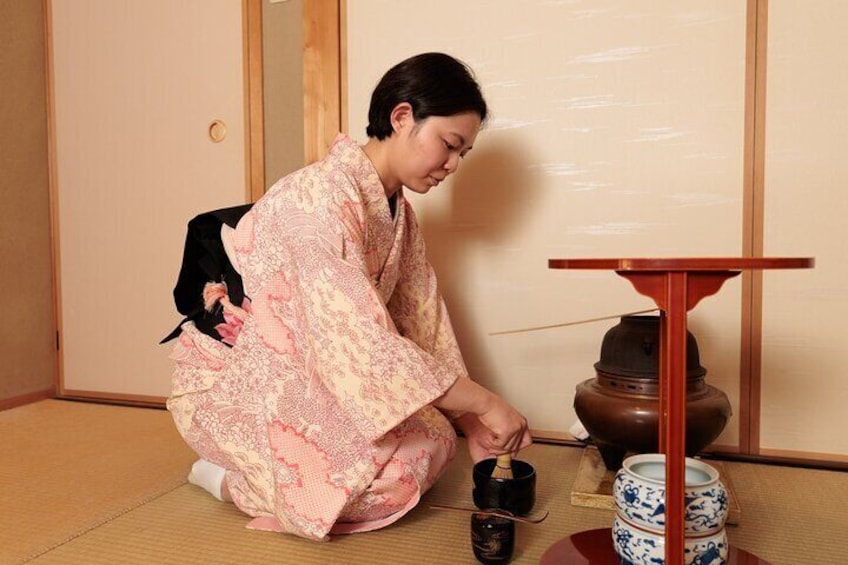Whisking matcha for guests.