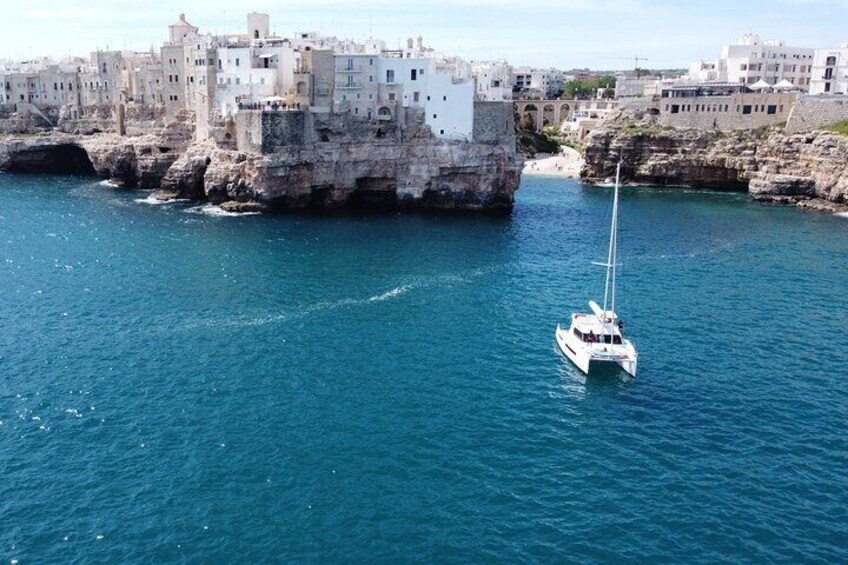 Guided Tour in Sailing Catamaran with Aperitif Included from Polignano