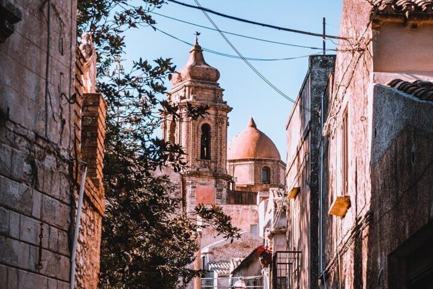 Glimpse of the church between the houses