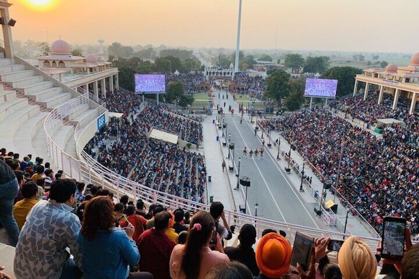 Tourist are watching wagan border parade in Amritsar.