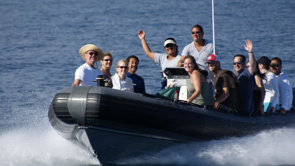 passengers in RIB enjoying high speed ride on ocean water in Kauai