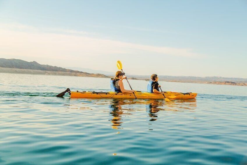 Two guests paddling in Lake Mead toward the Boulder Islands.
