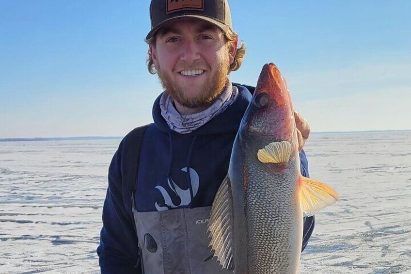 Happy customer with a big walleye 