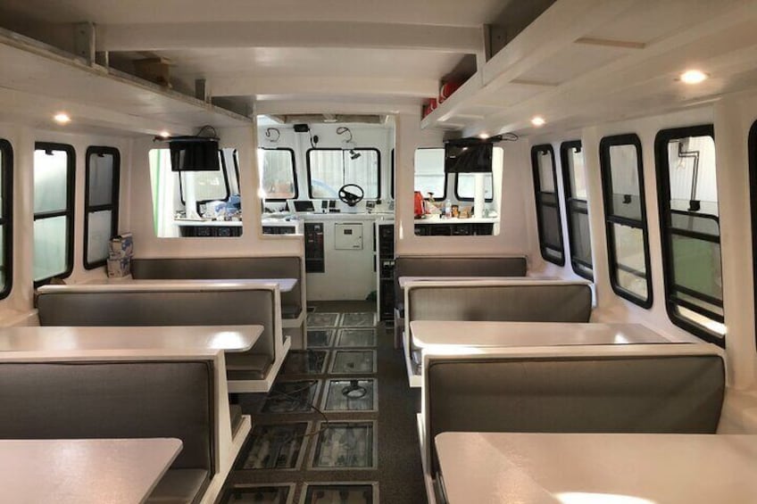 Booth seating for 34 people and bar seating for an additional 6 people, North America's LARGEST solar-powered vessel is licensed and has a full kitchen & bathroom on board.