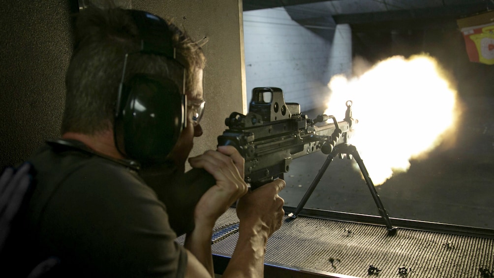 Man firing weapon at Machine Gun Vegas