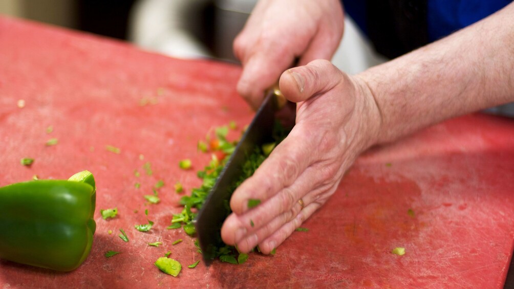 Peppers being chopped up in cooking class in Hanoi