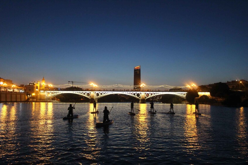 Picture 2 for Activity Seville: Sunset and Evening Paddle Boarding Tour