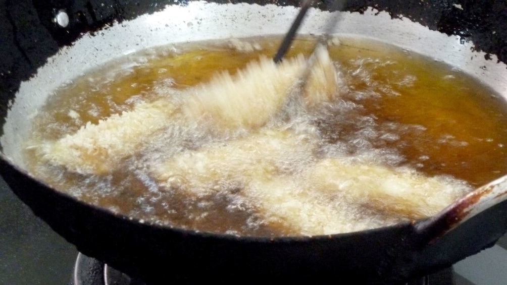 Food being rotated in hot oil in Hanoi