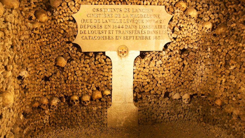 Craved stone sign within the catacombs in Paris