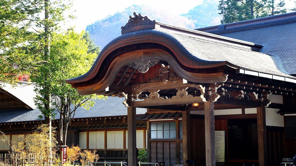 Elegant wooden roof and entrance way to building in Nikko