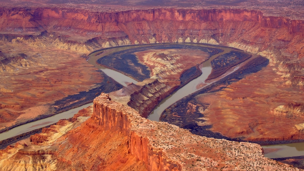 Aerial view of a river and canyon in Moab
