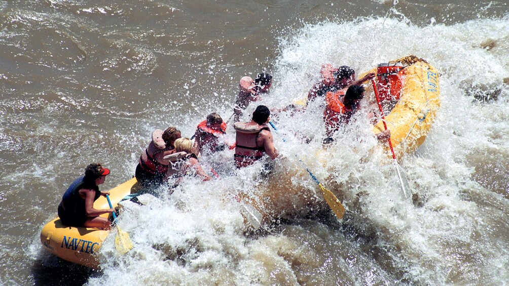 Rafting group getting splashed on a river in Utah