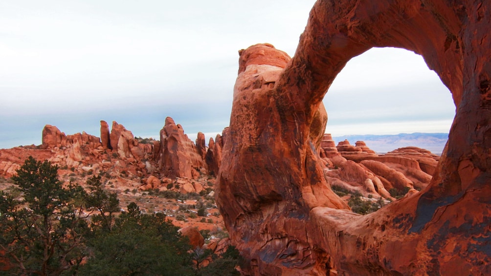 Archway through rock formation in Moab