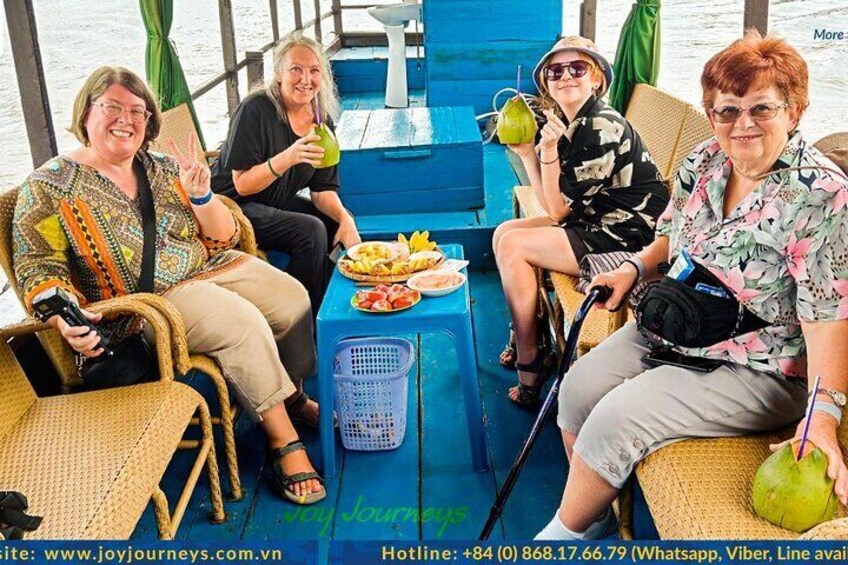 Having fruit and coconut juice while cruising
