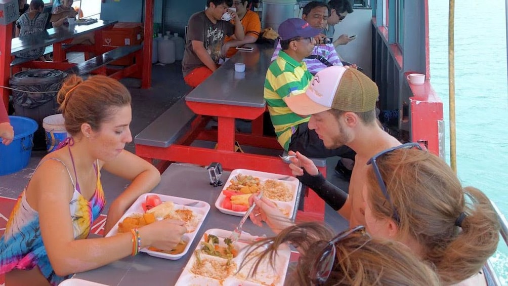 Group eating lunch on a boat on Samui Island