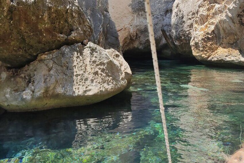 Private Boat Trip to Grama Bay & Sea Caves Explorations