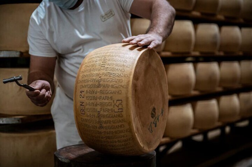Parmigiano Reggiano cheese inspection | Artemilia Guided Tours