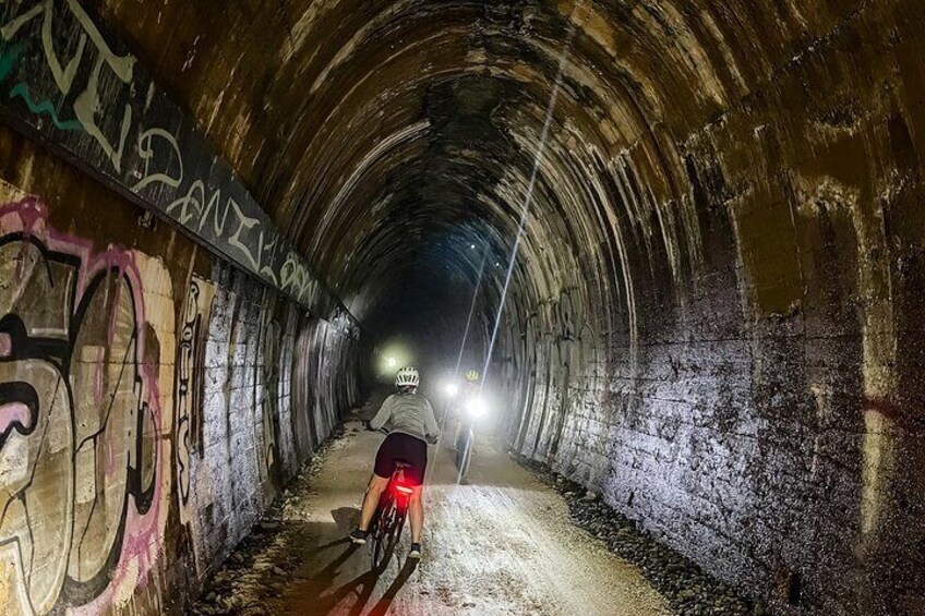 Navigating the 524m tunnel on the Northern Rivers Rail Trail