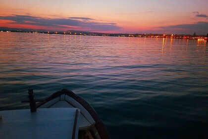 Sunset boat tour with aperitif and swimming break