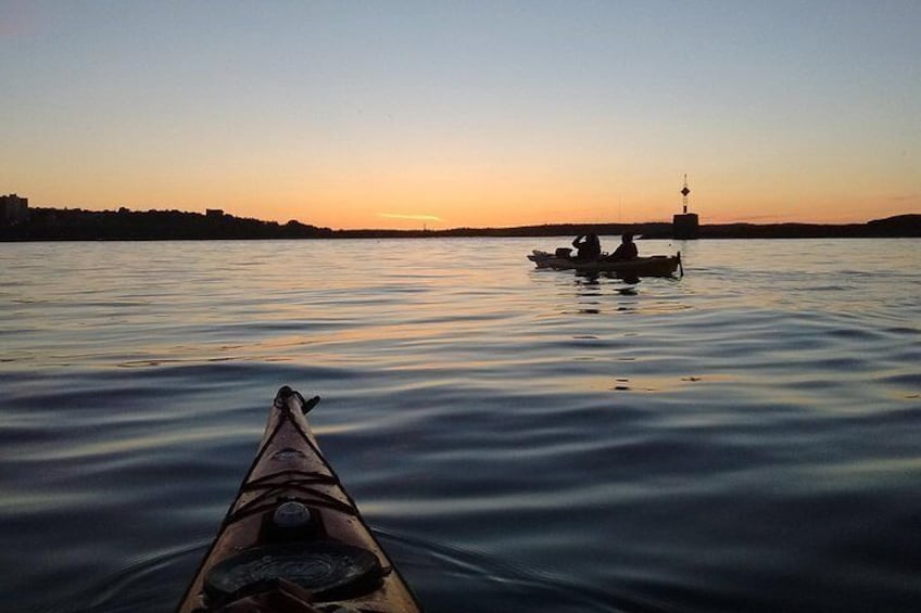 Paddlers enjoying the sunset on Casco Bay
