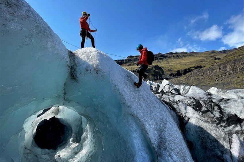 Accessing an ice cave with ropes