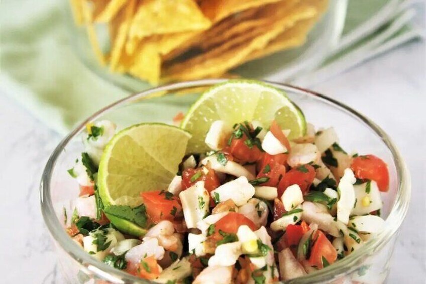 Ceviche, chips, black beans and pico de Gallo as a snack