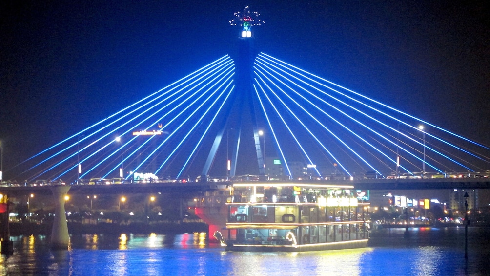 Bridge and boat at night in Da Nang