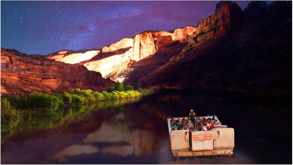 Show item 5 of 5. Night boat tour on a river in Utah with the Milky way