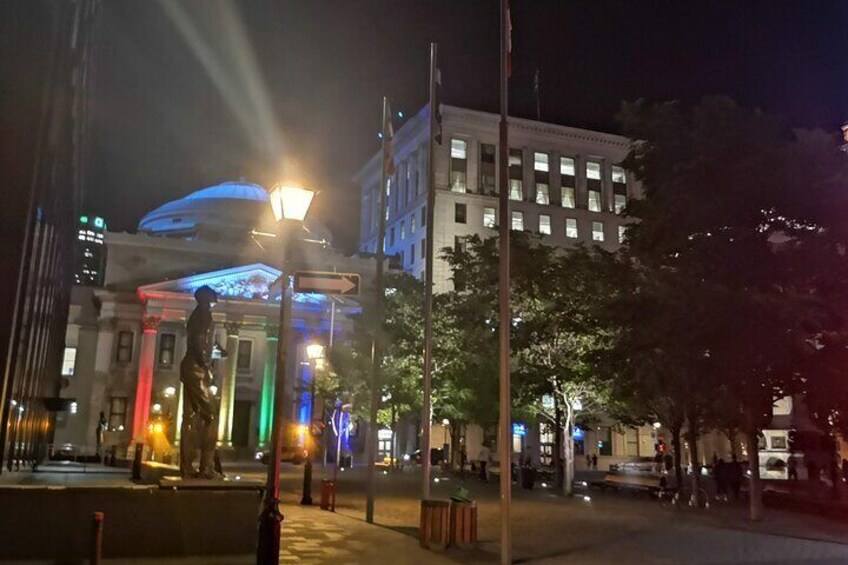 Place d'armes and the Bank of Montreal light up during evening walking tour with Ruby