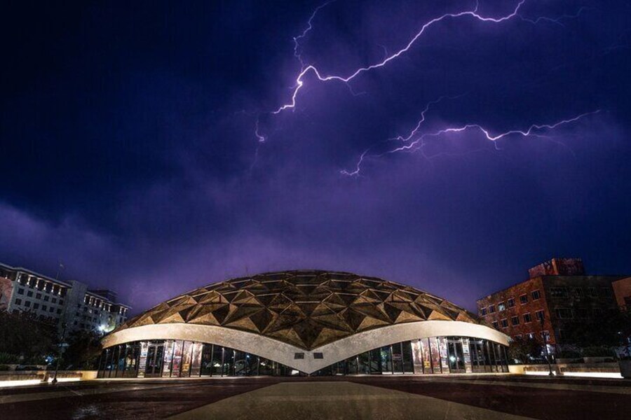 Night view of the Pioneer Center for the Performing Arts in Reno, Nevada, featuring its gold-domed architecture.