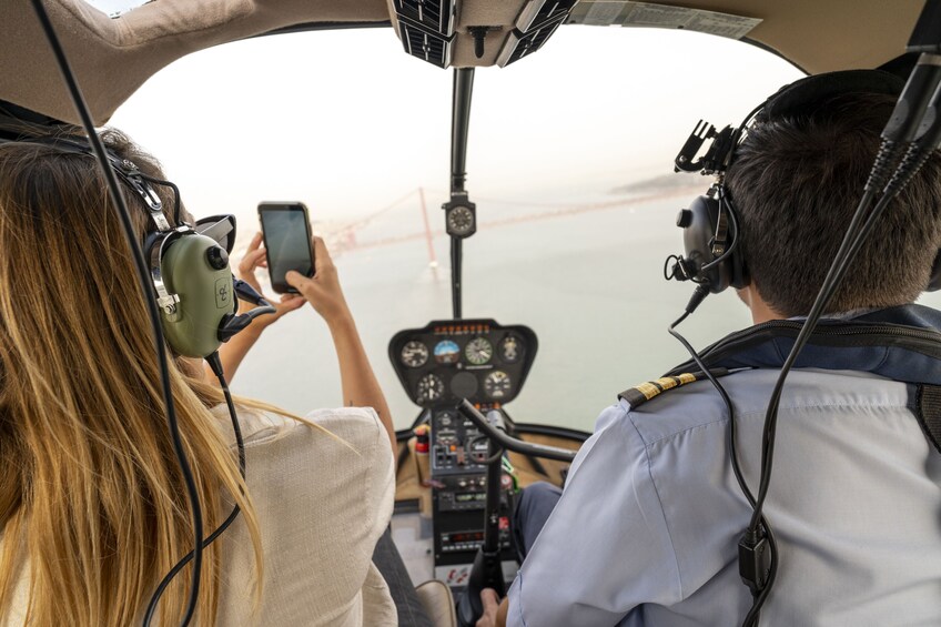 Lisbon 360 City Tour: Bike tour, Boat Trip & Helicopter Flight