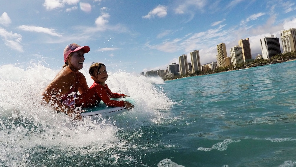 Mother and son having fun on the Ohana Private Bodyboarding Lesson in Oahu