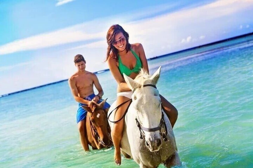 Horse back riding in the ocean