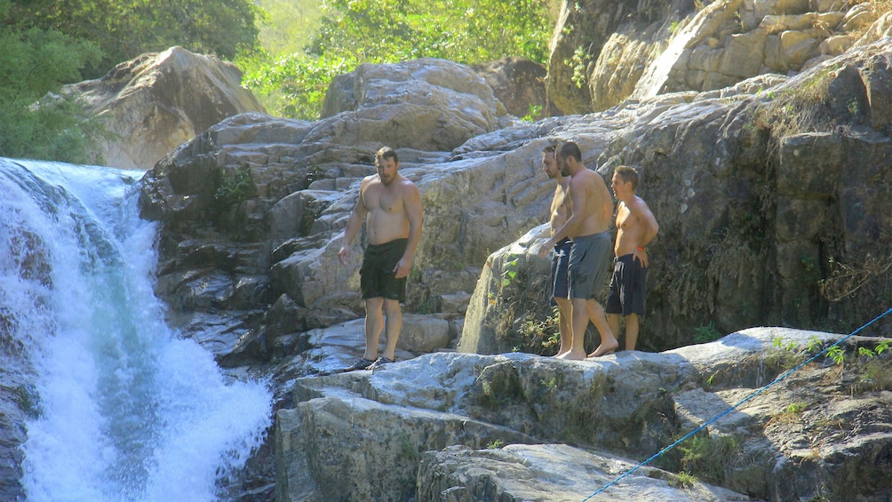 Men getting ready to swim in the waterfalls in Puerto Vallarta, Mexico