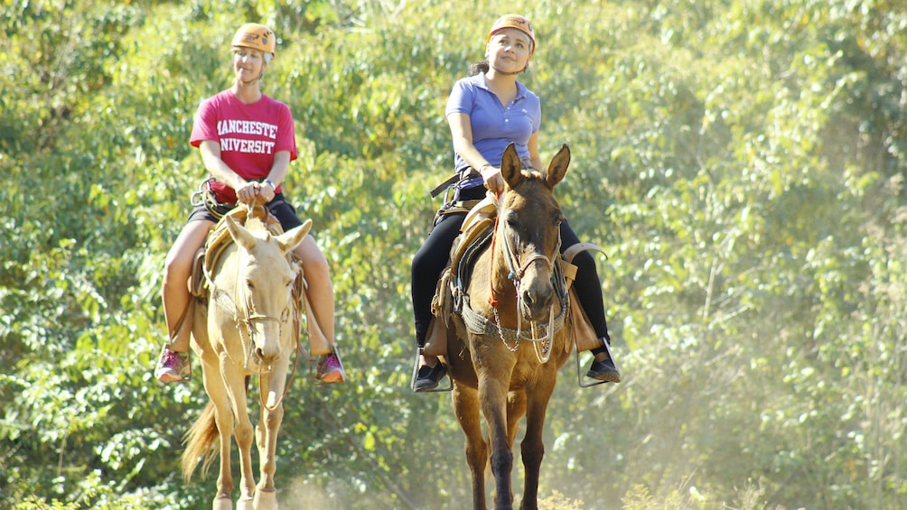 Ladies on the mule ride tour in Puerto Vallarta, Mexico