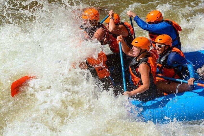 Paddlers hit a big wave in Sunshine Rapid - a class IV rapid in the Royal Gorge