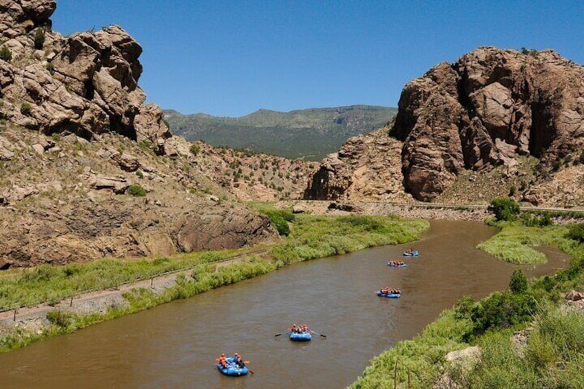 Inspiring views accompany thrilling white water on Echo Canyon's Bighorn Sheep Canyon rafting experience.