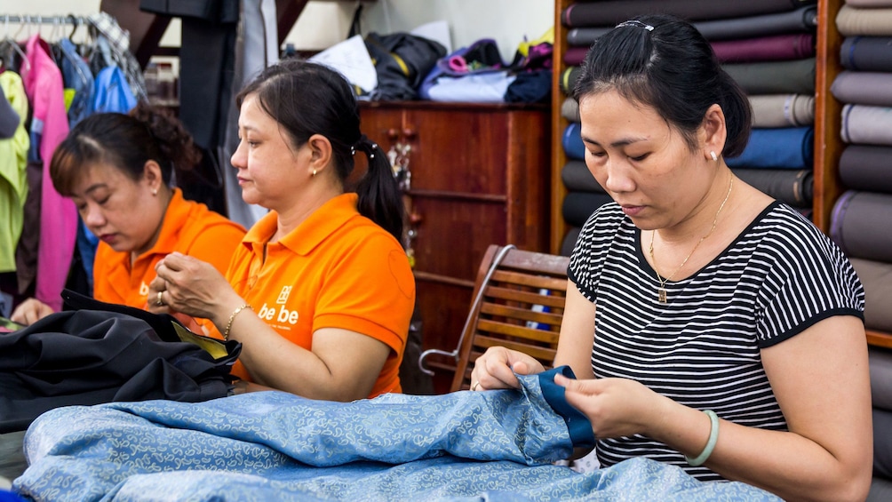 Women working on clothing in Hoi An