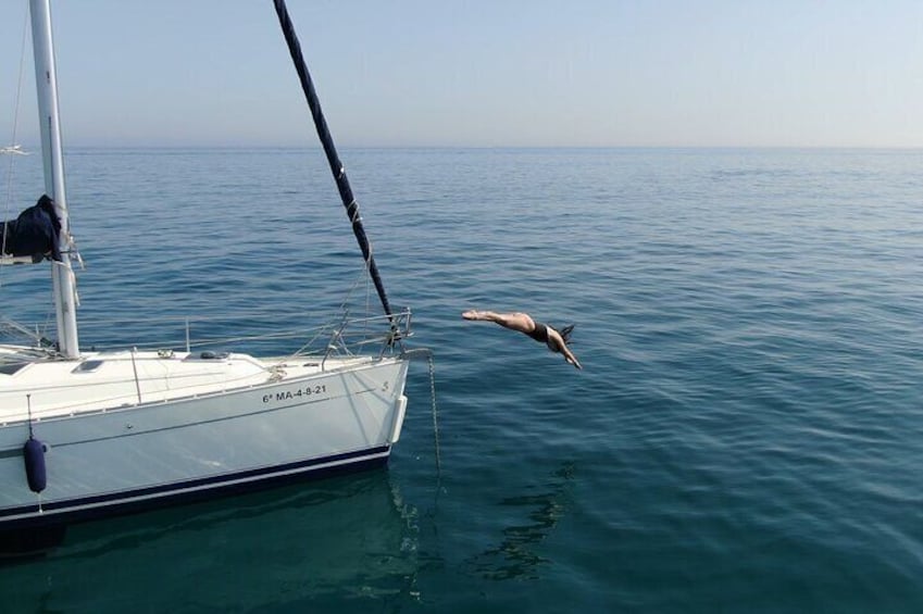Bathing in the sea from a private sailboat