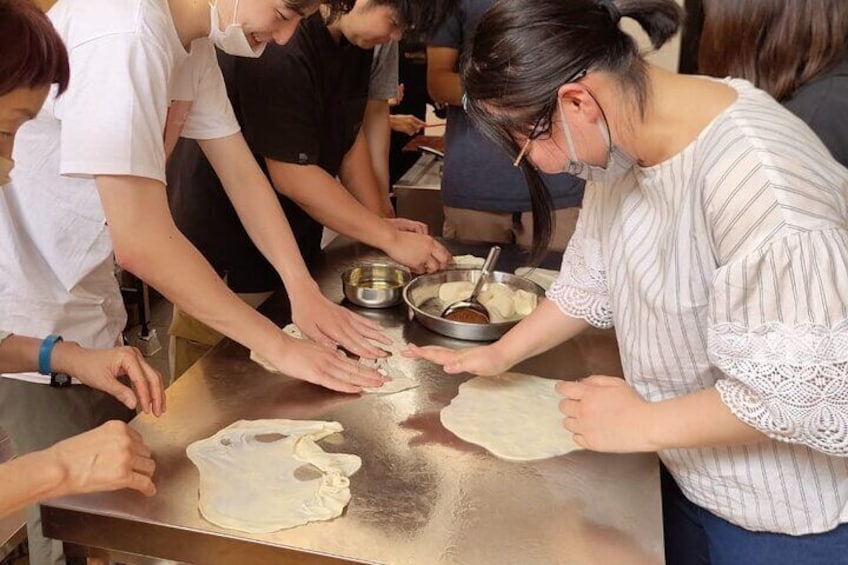 Japanese Student having fun with roti Canai Dough