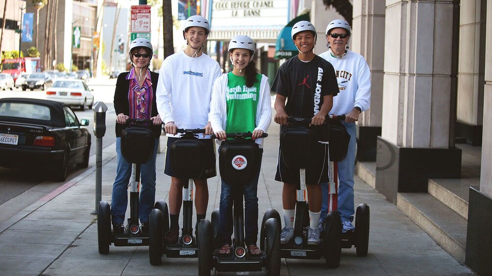 Segway riders on a street in Beverly Hills.