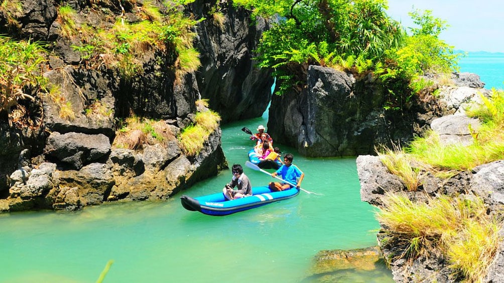 Group in inflatable kayaks on James Bond Island