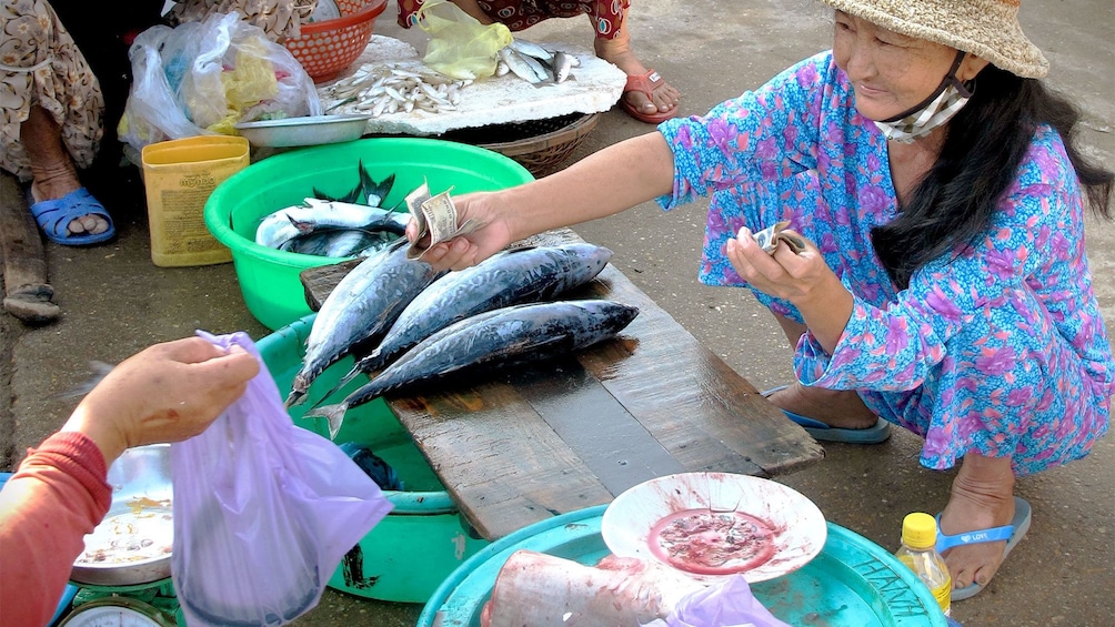 Woman selling fish at the Hoi An, Vietnam