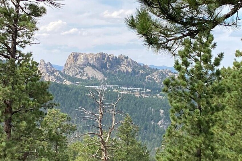 A view of Mount Rushmore from the summit of Iron Mountain.