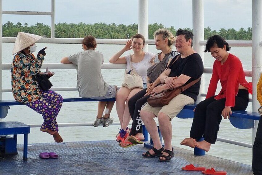 Join in a local ferry to cross Mekong